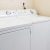 side-by-side washer/dryer units in lighted closet