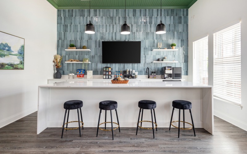Community clubhouse with blue tile wall and green ceiling